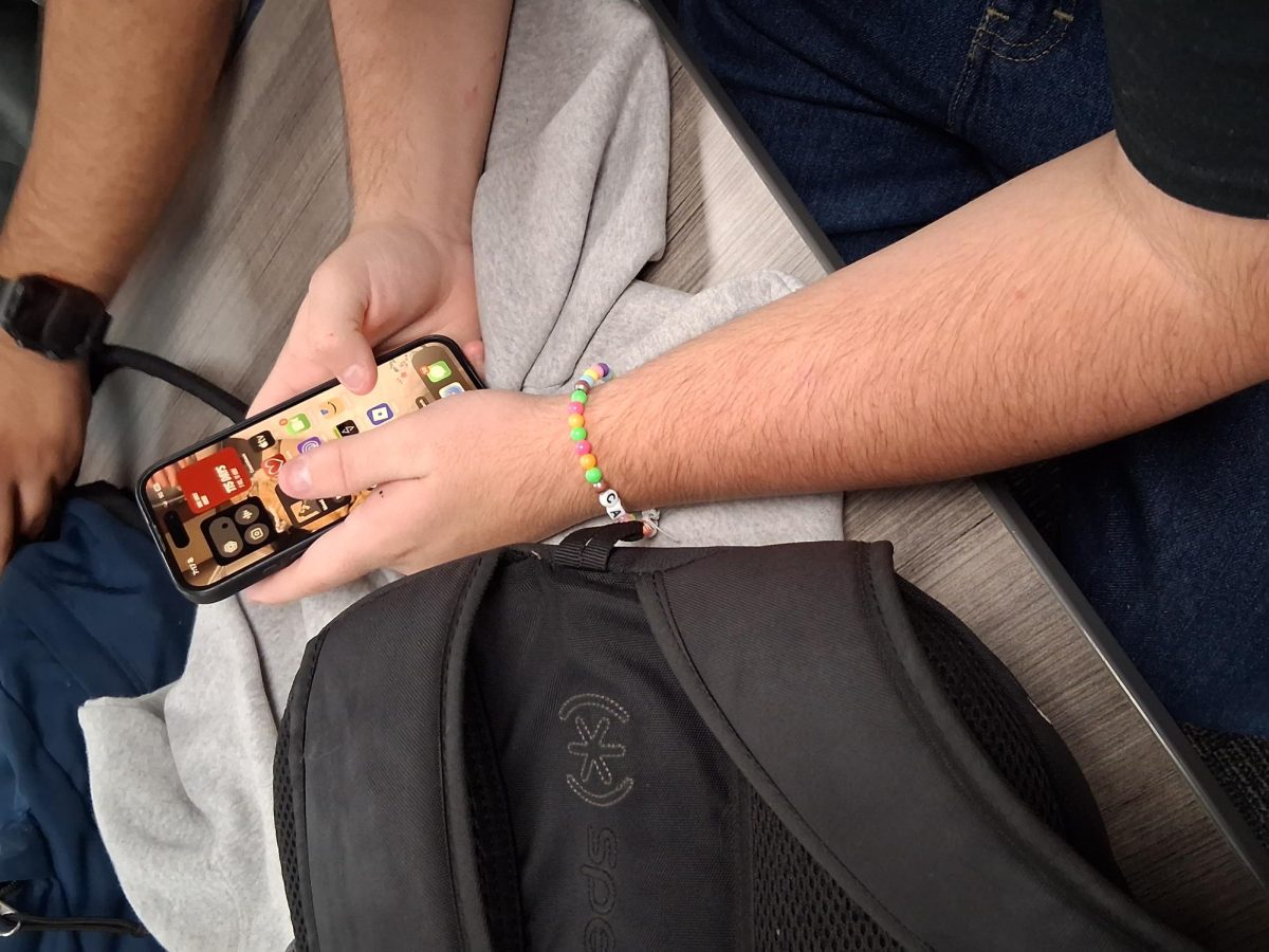 North Canyon student using their phone
