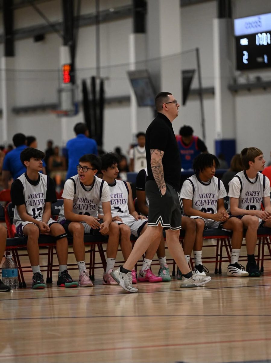 The North Canyon Boys basketball team, including Coach Lopez.